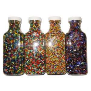  GOT BEADS? 4 bottles of glass beads in assorted colors 