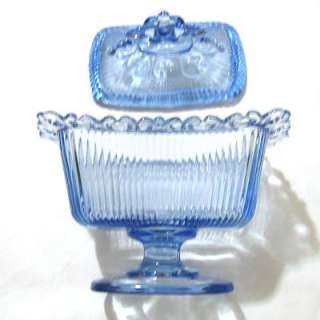 Vintage blue depression glass compote container covered with lid
