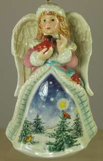   CHRISTMAS ORNAMENT ANGEL IN WINTER CLOTHES HOLDING RED CARDINAL BIRD