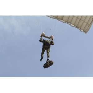 member of the Pathfinder Platoon prepares to land from a parachute 