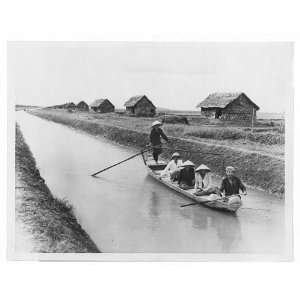  Refugees,South Vietnam,sampan,canal,straw dwellings