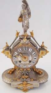  French 2 tone silver & gold gilded 8 day bell strike mantel clock