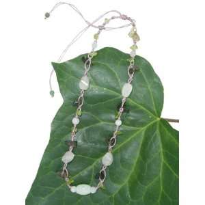   Necklace Centered with Jade Oval Carving Made with Lavender Cord
